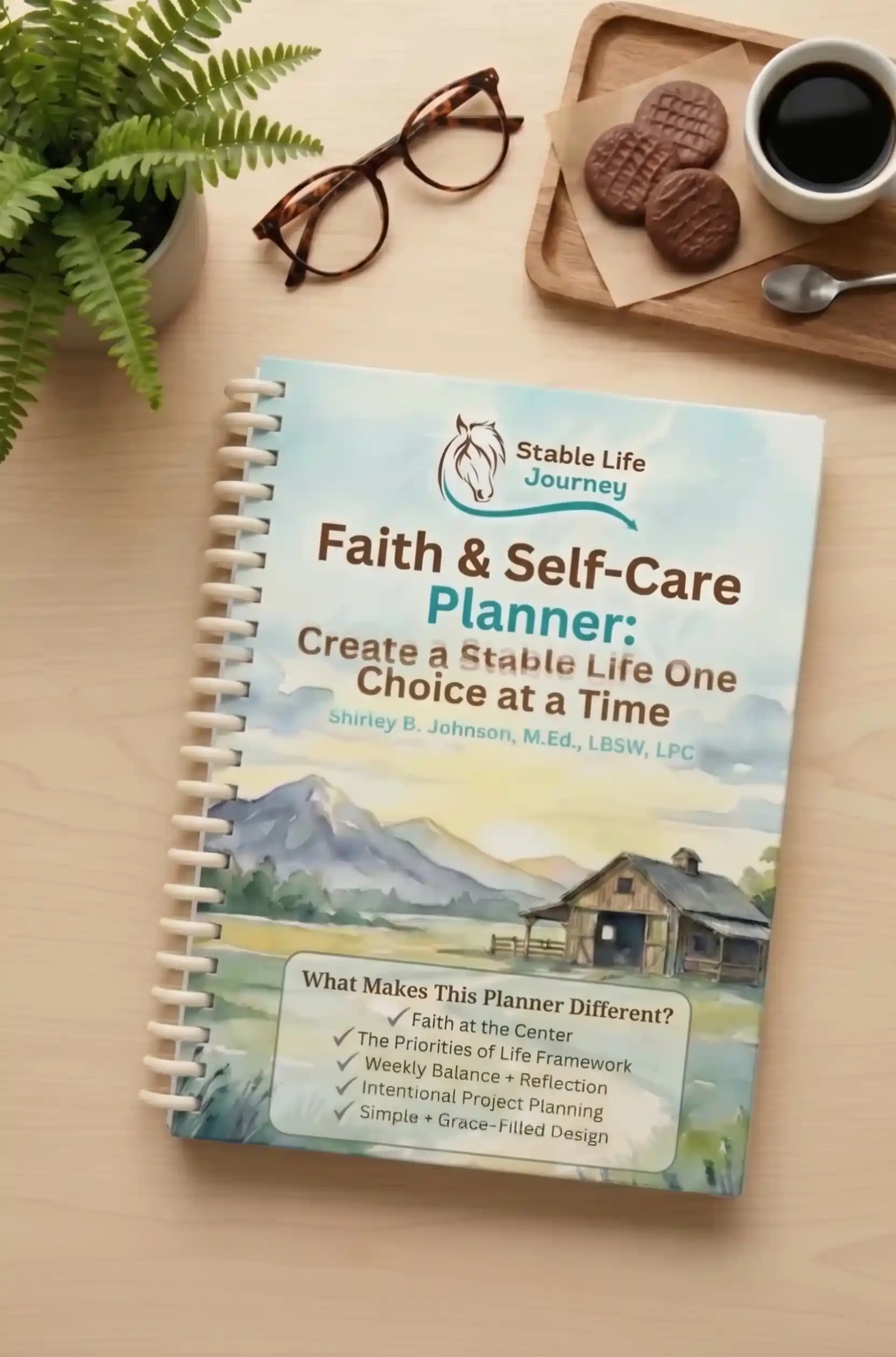 christian weekly planner notebook sitting on table